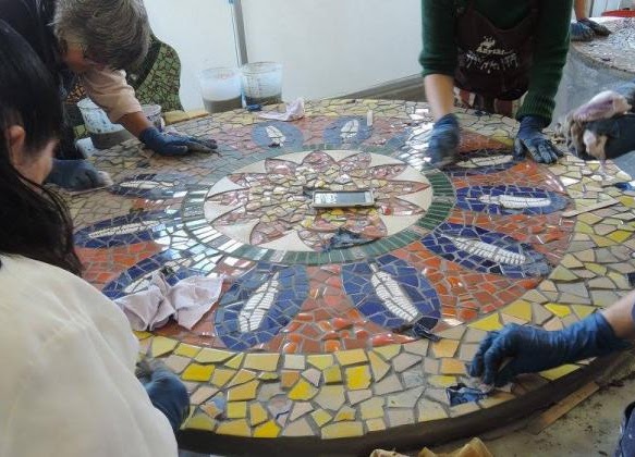 Photo of Piece by Piece Artist working on a Mosaic Mandala